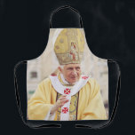 Pope Benedict XVI The Teacher of Truth Apron<br><div class="desc">Elevate your space with the serene and scholarly presence of Pope Benedict XVI. This high-fidelity reproduction portrays the Pope in a moment of prayerful reflection, embodying the "humble worker in the vineyard of the Lord." The composition highlights the dignity of the papacy and the personal warmth of Joseph Ratzinger, known...</div>