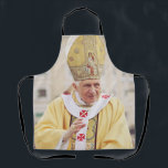 Pope Benedict XVI The Teacher of Truth Apron<br><div class="desc">Elevate your space with the serene and scholarly presence of Pope Benedict XVI. This high-fidelity reproduction portrays the Pope in a moment of prayerful reflection, embodying the "humble worker in the vineyard of the Lord." The composition highlights the dignity of the papacy and the personal warmth of Joseph Ratzinger, known...</div>