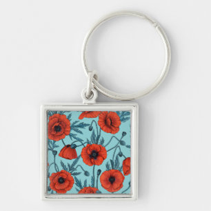 Poppies, red and blue on pool blue key ring