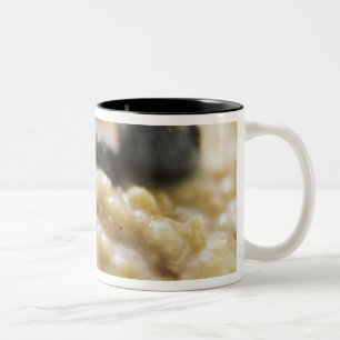 Porridge with berries, close-up Two-Tone coffee mug