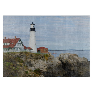 Portland Headlight lighthouse on rocky shore Cutting Board
