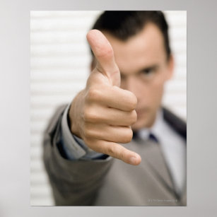 Portrait of a businessman making a thumbs up poster
