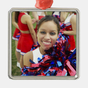 Portrait of a Cheerleader in Front of a Group of Metal Tree Decoration
