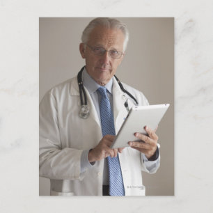 Portrait of a medical doctor holding a digital postcard