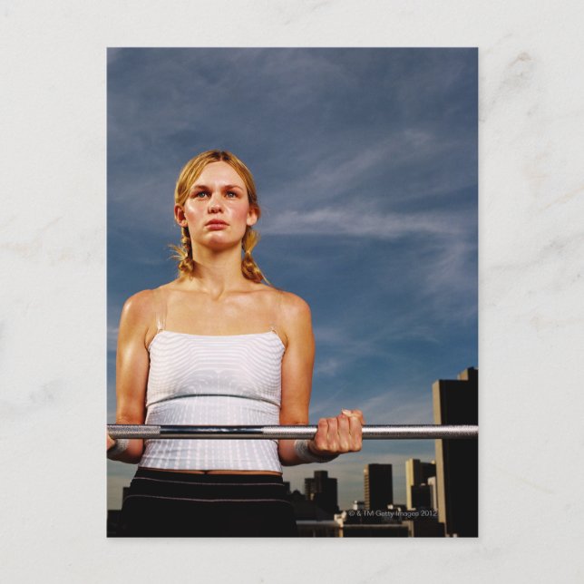 Portrait of a young woman carrying a barbell postcard (Front)