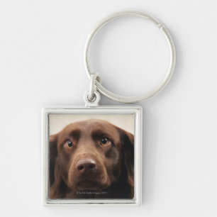 Portrait of an apprehensive young female key ring
