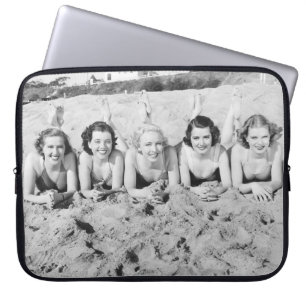 Portrait of five young women lying on the beach an laptop sleeve