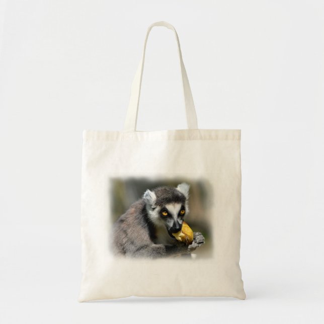 Portrait ring-tailed lemur eating a banana tote bag (Front)