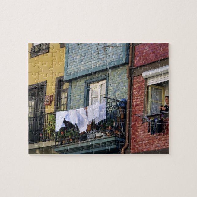 Portugal, Oporto (Porto). Woman hanging laundry Jigsaw Puzzle (Horizontal)