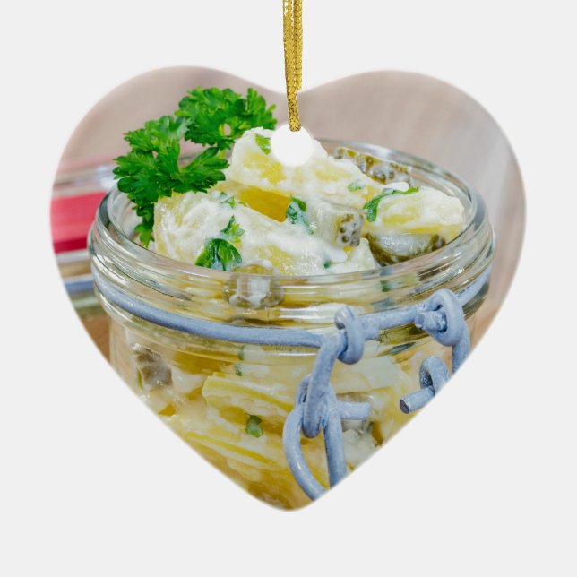 Potato salad in a jar on wooden ceramic tree decoration (Front)