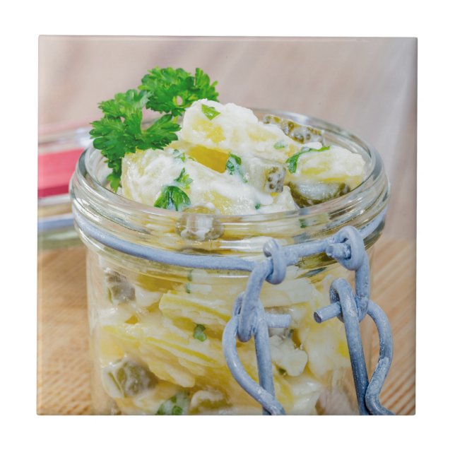 Potato salad in a jar on wooden tile (Front)