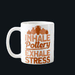 Pottery Makers Inhale Pottery Exhale Stress Potter Coffee Mug<br><div class="desc">Pottery Makers Inhale Pottery Exhale Stress Pottery Clay: Unleash your inner artist with our pottery clay, perfect for crafting unique creations and exploring the therapeutic world of ceramics. Mould, shape, and express yourself as you transform simple clay into tangible art, finding relaxation and satisfaction in the process.</div>