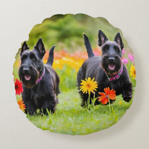 Prancing Scottish Terriers in grass and flowers Round Cushion