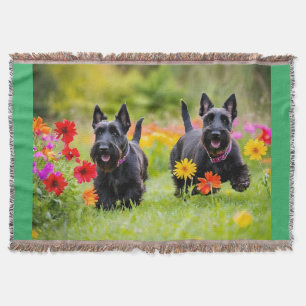 Prancing Scottish Terriers in grass and flowers Throw Blanket