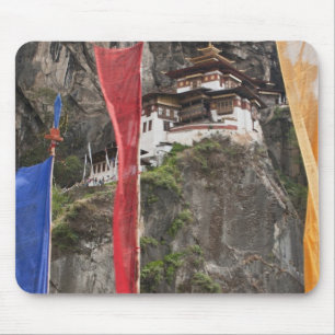 Prayer flags hang near Taktshang Mouse Mat