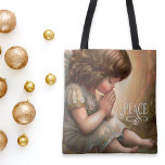 Praying Little Girl Angel Radiant Light Halo Tote Bag<br><div class="desc">Cute,  little,  brown haired,  praying angel painting with rosy cheeks,  dressed in off-white gown and a radiant light halo.  She has a message of Peace.  Vintage style painting design with Peace typography which has swirl and scroll lettering.</div>