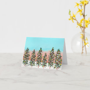 Pre-dawn row of colourful Christmas trees Card