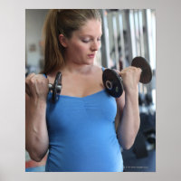 pregnant woman exercising at health club