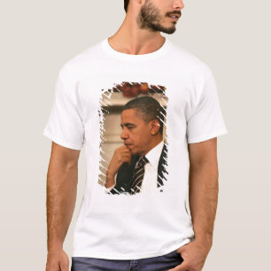 President Barack Obama reflects as he meets T-Shirt