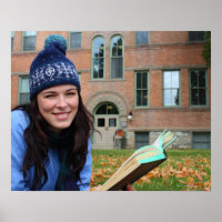 Pretty college student studying in autumn leaves
