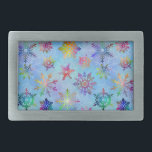 Pretty Colourful Snowflakes Christmas Pattern Rectangular Belt Buckle<br><div class="desc">This beautiful Christmas / winter pattern design features snowflakes with a tiedyed,  marbled effect in a rainbow of colours on a blue background. The snowflakes seem to glow and shine in this pretty wintery,  modern pattern. Use as a background for your holiday text or photos or enjoy it as-is.</div>