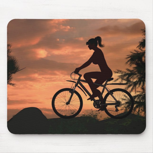 Pretty girl riding her bike at sunset mouse mat (Front)