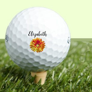 Pretty orange daisy flower with custom name ladies golf balls