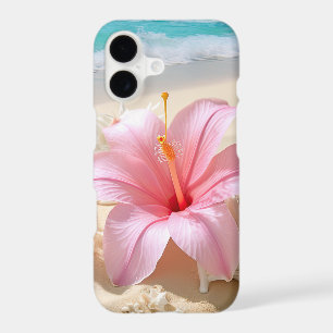PRETTY PINK HIBISCUS FLOWER ON SANDY BEACH