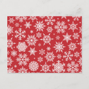 Pretty snowflakes on red background postcard