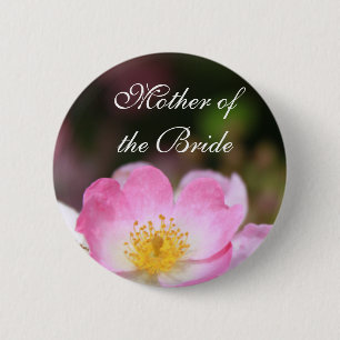 Pretty wild pink rose flower button for weddings.