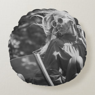 Pretty woman in convertible car round cushion