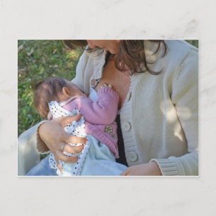 Pretty young brunette mum breastfeeding her baby postcard