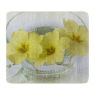 primrose in a coffee cup cutting board