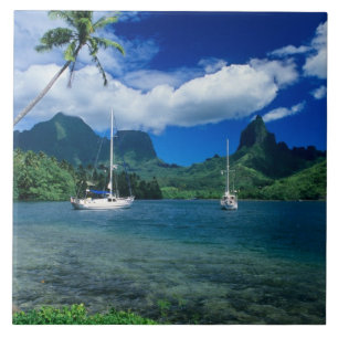 Private yachts anchored in Opunohu Bay on the Tile