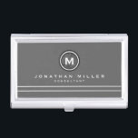 Professional Grey & White Monogram Medallion Business Card Holder<br><div class="desc">Professional business card holder features simple grey and white design with a stylised monogram medallion in black and white with modern typography, with custom name and title or role in a coordinating white typography on a grey background with two complimentary white stripes to balance the overall design. Shown with personalised...</div>