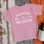 Promoted to Big Sister Pregnancy Announcement Baby T-Shirt<br><div class="desc">Custom printed apparel personalised with "Promoted to Big Sister" graphic in trendy modern fonts with a boho arrow design. Perfect for a pregnancy announcement photo or a gift for older siblings when new baby arrives! Use the design tools to edit the colours or add your own text and photos to...</div>