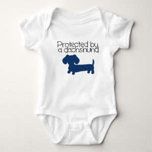 Protected by a Dachshund (blue) Baby Bodysuit