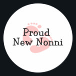 Proud New Nonni Baby Girl Footprints Classic Round Sticker<br><div class="desc">Our Proud New Nonni T-shirt design is available with blue or pink baby footprints for a baby girl or baby boy.  Our baby footprint new grandparent  announcement design is available on tees,  shirts,  sweatshirts,  tote bags,  hats,  buttons,  mugs & more.</div>