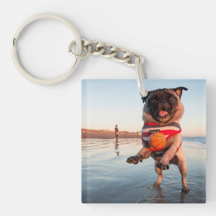 Pug Playing Ball on Beach Key Ring