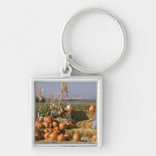 Pumpkin display with hay bales and scarecrows key ring