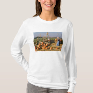 Pumpkin display with hay bales and scarecrows T-Shirt