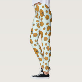 Pumpkin surface pattern design on aqua background leggings