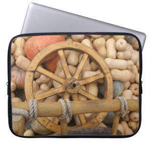 Pumpkins and Wheel of the rural wooden cart Laptop Sleeve