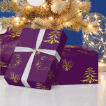Purple and Gold Christmas Wrapping Paper<br><div class="desc">A very decorative Christmas wrapping paper of purple and gold,  featuring gold ornamental elements of holly,  Christmas trees,  gold stars and a large gold decoration to add a very elegant touch to your gift wrapping for this holiday season.</div>
