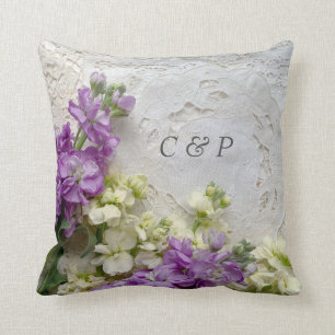 Purple and white flowers on old laces cushion