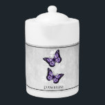 Purple Butterfly Floral Teapot<br><div class="desc">Enjoy your tea with a Purple Butterfly Floral Personalised Teapot.  Teapot design features a pair of vibrant butterflies resting on a white floral vine against a light grey grunge background. Additional gift items available with this design as well as a variety of colours.</div>