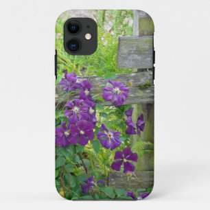 Purple clematis flowers on wooden fence iPhone 11 case
