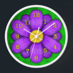 Purple Daisy Flower on Green Beautiful Wall Clock<br><div class="desc">This pretty floral clock has an original stylised flower, in a daisy style and coloured shades of purple. The yellow-orange clock numbers mark the time on the twelve petals. The background is done in an abstract mottled green, resembling grass. This is a bright, bold clock for a gardener or any...</div>