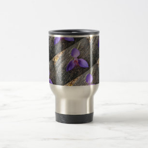 Purple flower on a bench travel mug