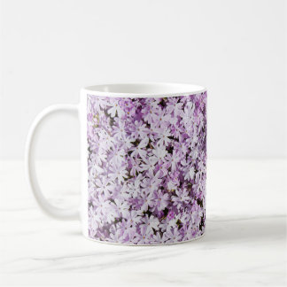Purple flower, summer freshness backdrop. coffee mug